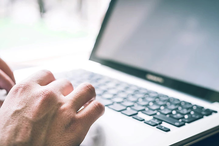 Typing On Laptop